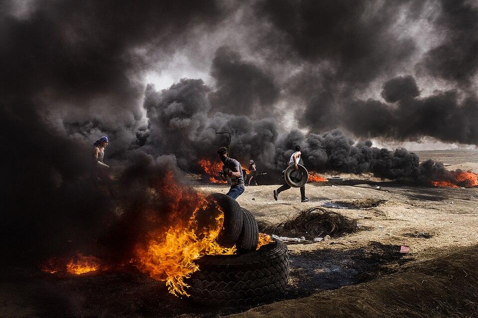 Necklacing execution by burning tyre haunts photojournalists 